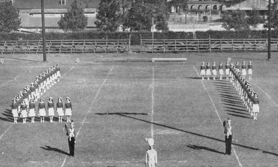 Pep squad performs at a football game at Louisiana Polytechnic Institute, spelling out "LT"